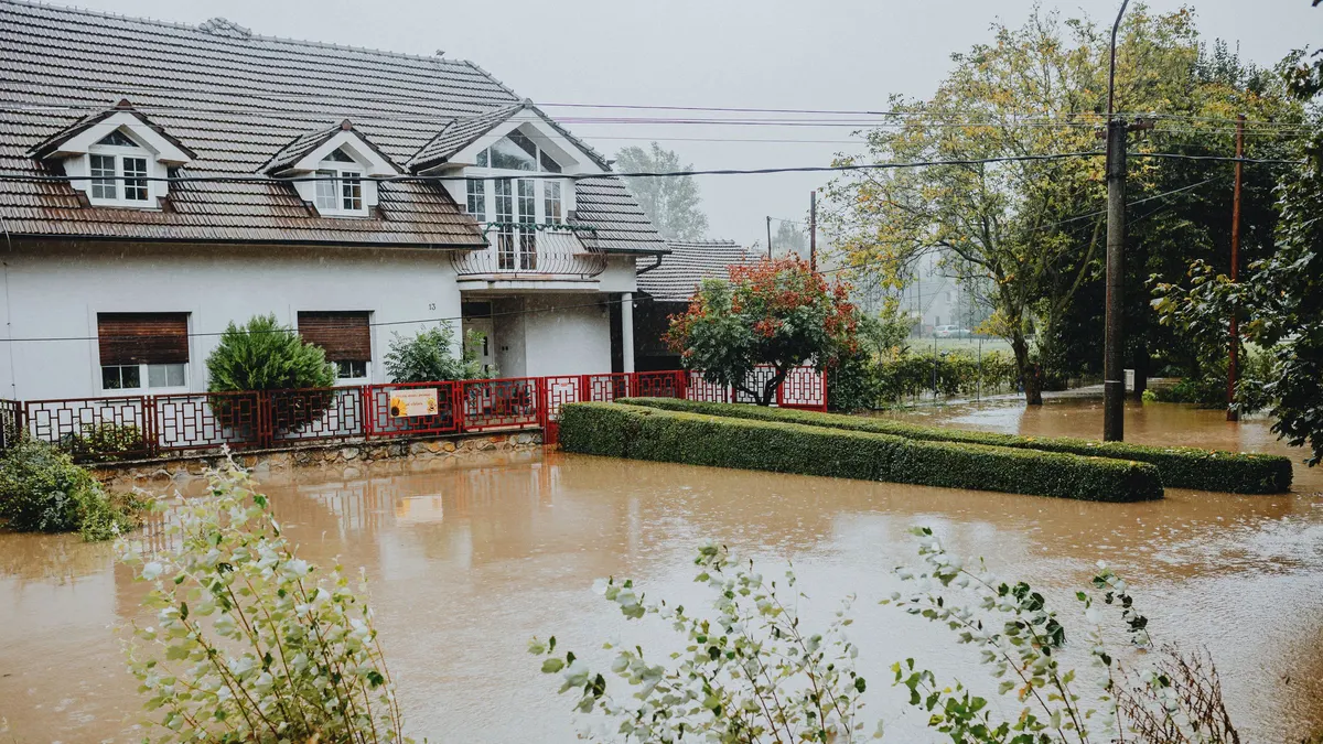 Flood water surrounding a house and its garden